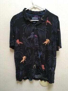 American Rag adorable animal print blouse on black background.